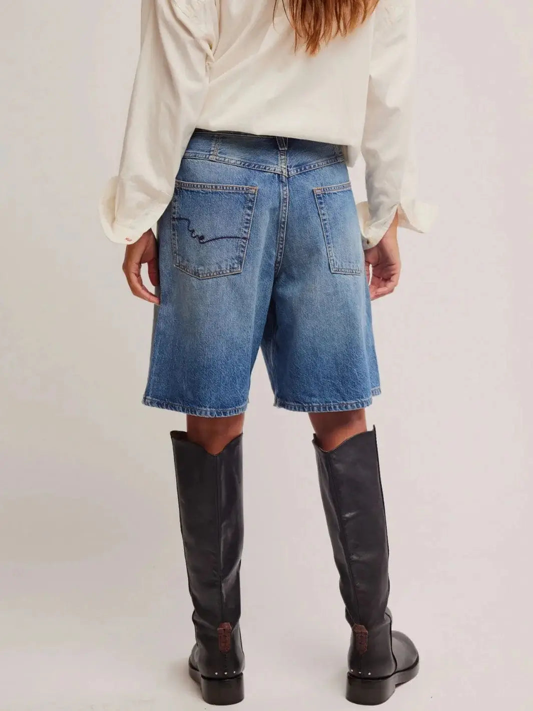 A full rear view emphasizes the relaxed fit through the hips, distinct pocket placement, and straight-leg hemline of the Free People Montana Shorts in Haven | Twentyseven Toronto