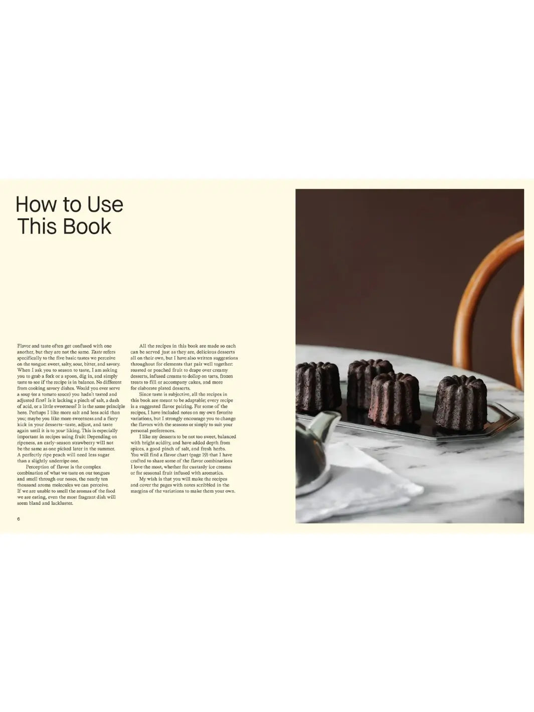Instructional spread titled "How to Use This Book" from More Than Sweet: Desserts with Flavor by Marie Frank, including text about the perception of flavour on the left and a photograph of three dark, caramelized canelés on a marble surface on the right | Twentyseven Toronto