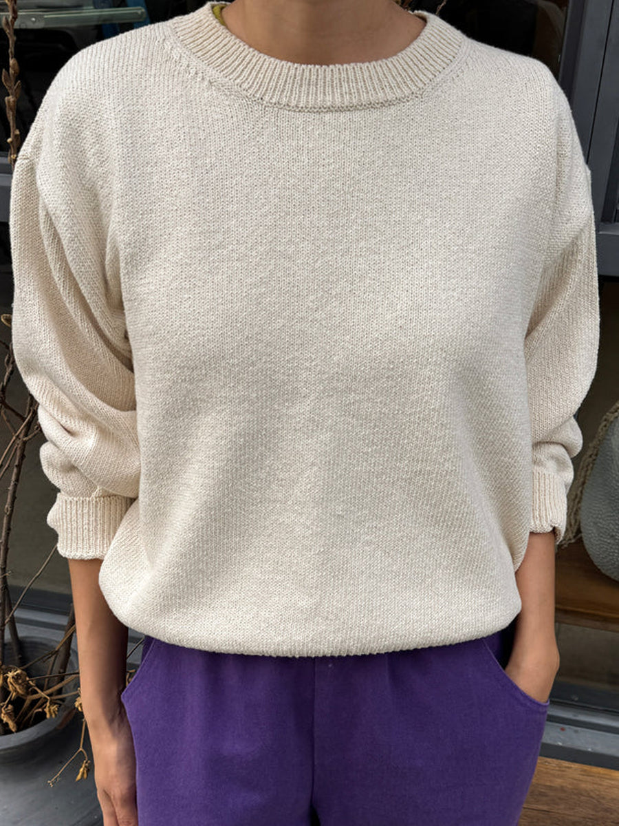 Model wearing the Le Bon Shoppe Milo Cotton Sweater in Natural with purple pants | Twentyseven Toronto