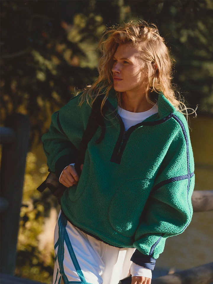 FP Movement Mountain High Half-Zip Fleece in green styled outdoors, featuring a relaxed fit and navy contrast seam detailing | Twentyseven Toronto
