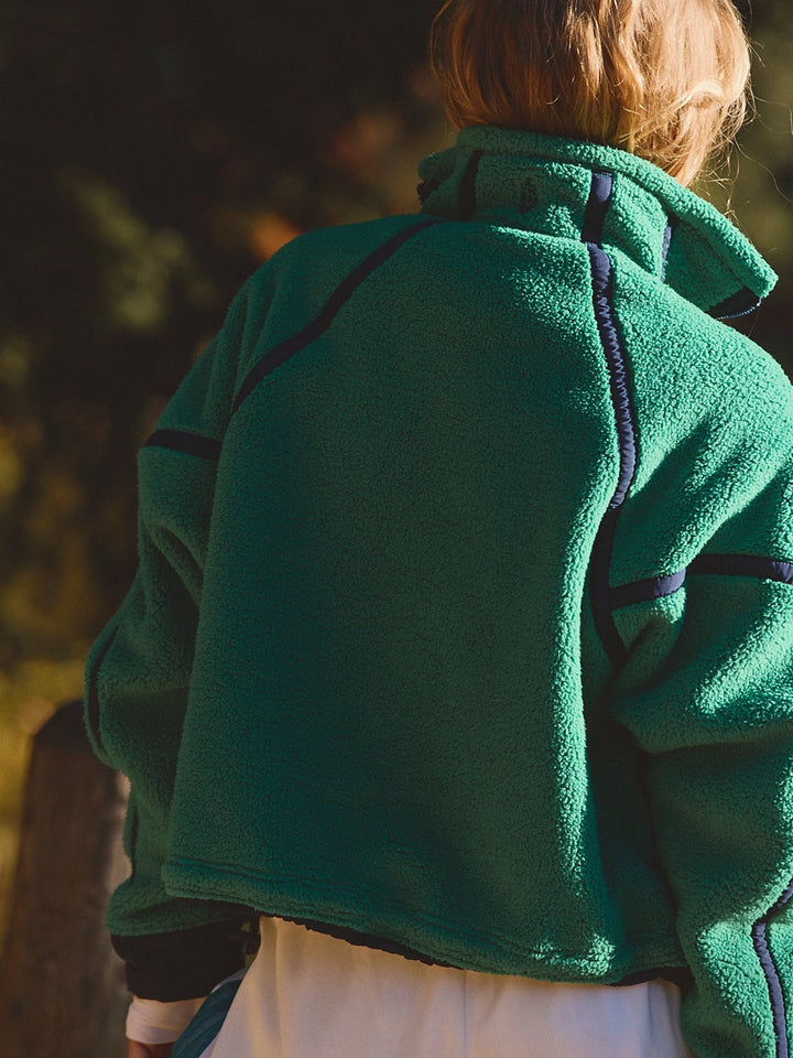 Back view of the FP Movement Mountain High Half-Zip Fleece in green, showing its oversized silhouette and contrast seam detailing | Twentyseven Toronto
