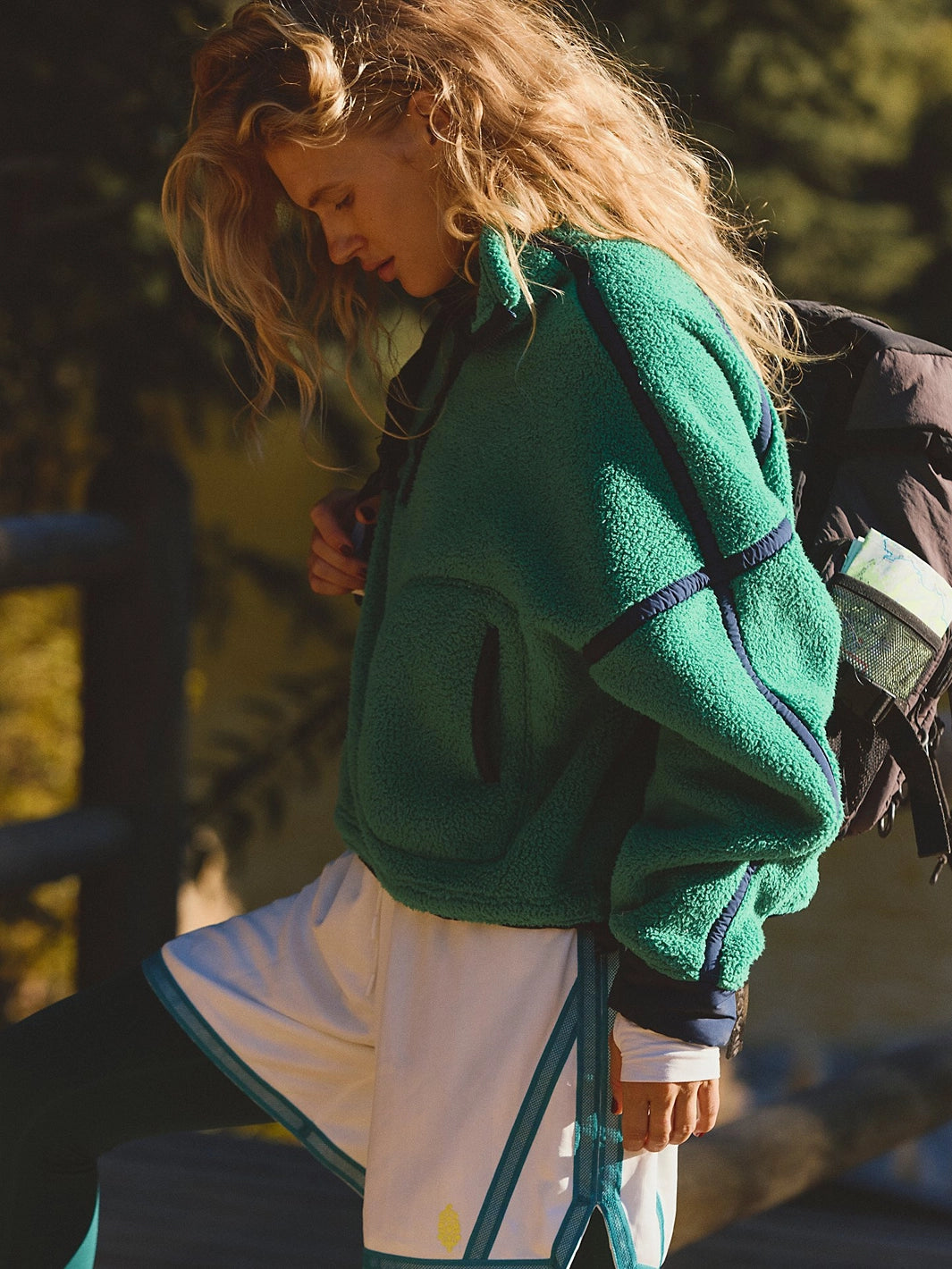 Side view of the FP Movement Mountain High Half-Zip Fleece in green, featuring contrast seams, zip pockets and a relaxed fit | Twentyseven Toronto