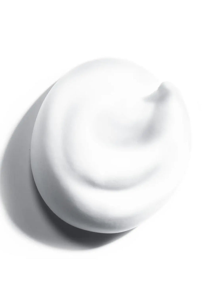 White hair mousse texture swatch of Leonor Greyl 'Mousse au Lotus Volumatrice' on a white background | Twentyseven Toronto
