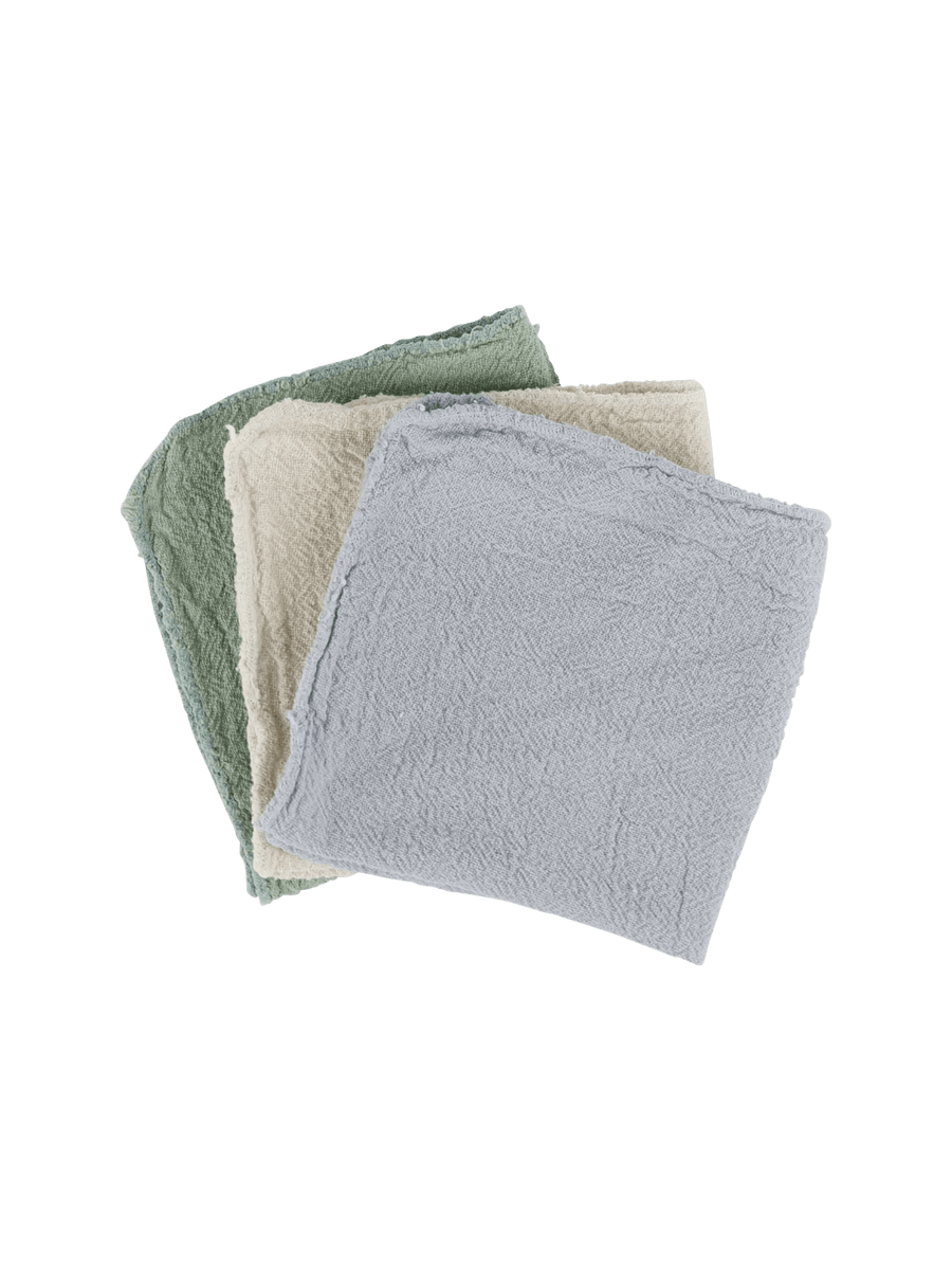 Three multi-purposed cotton towels in green, beige, and gray from Burstenhaus Redecker on a transparent background | Twentyseven Toronto