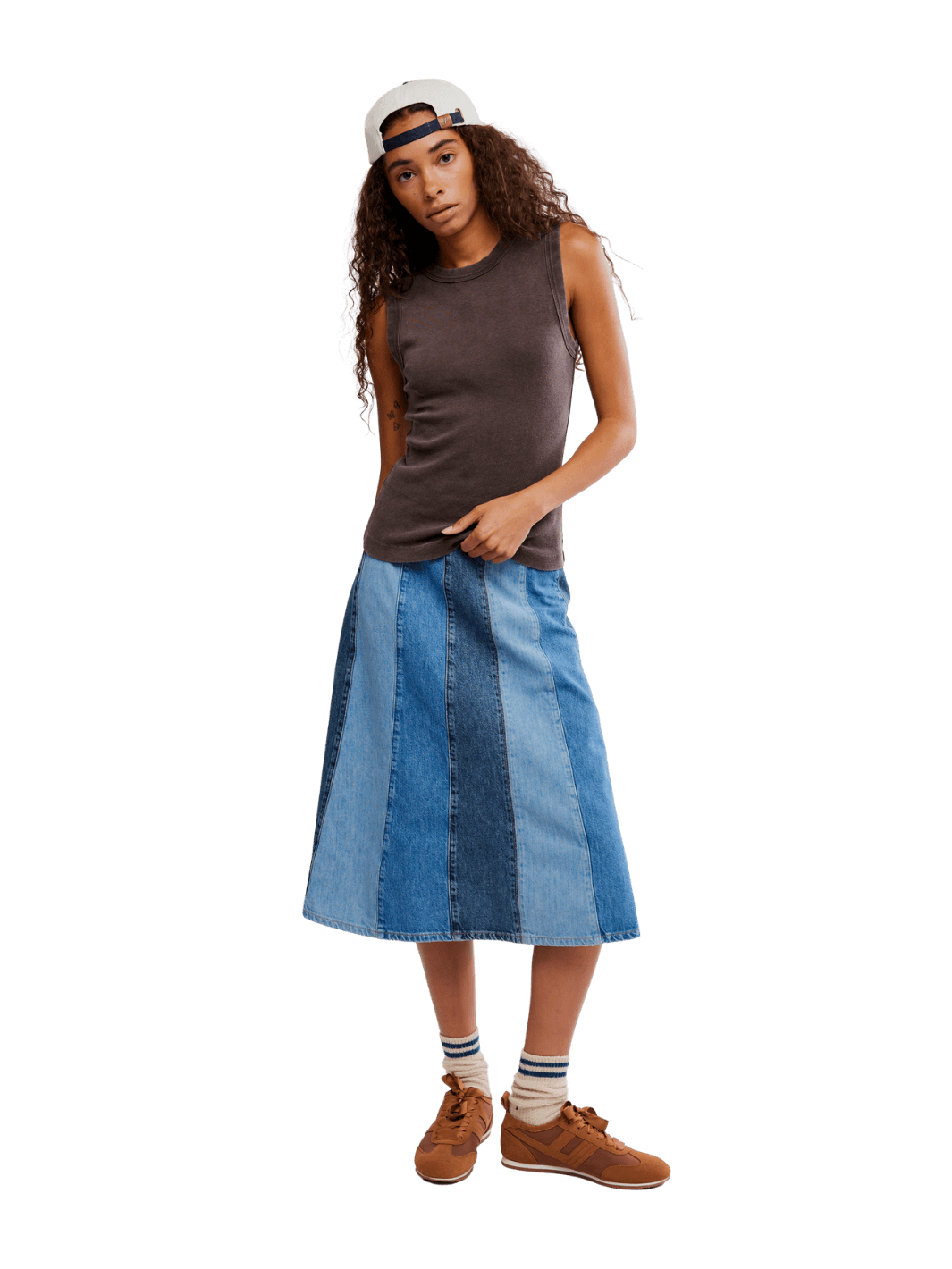 Woman wearing a brown 'Murphy Tank' top in Chocolatier and blue patchwork skirt from Free People on a transparent background | Twentyseven Toronto