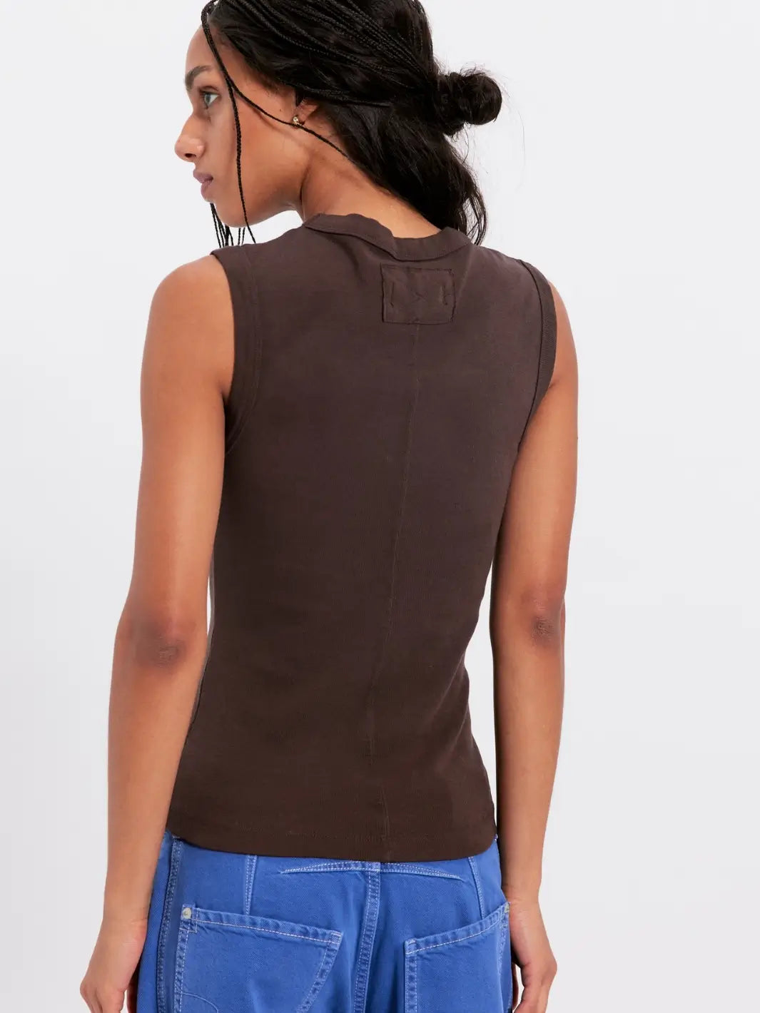 Woman wearing back view of a brown 'Murphy Tank' top in Chocolatier from Free People on a white background | Twentyseven Toronto