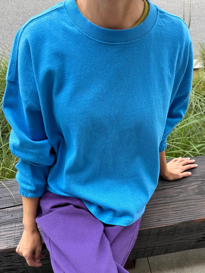 Le Bon Shoppe Model wearing the Le Bon Shoppe Naturelle Tee in French Blue with purple pants | Twentyseven Toronto