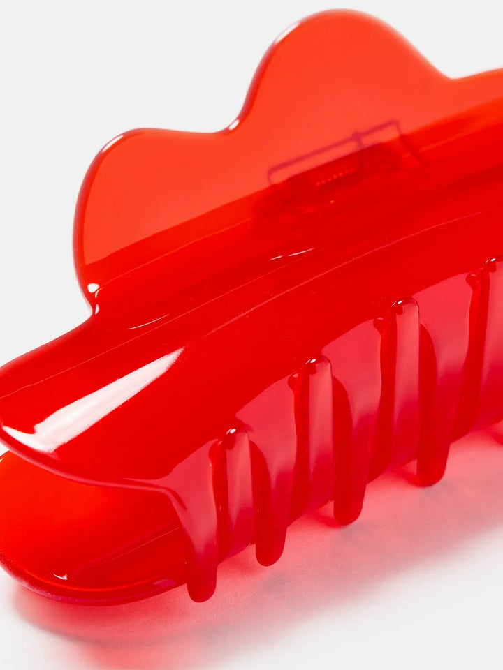 Close-up of the Chunks Nimbus Claw in Candy Red showing its glossy translucent finish and curved teeth | Twentyseven Toronto