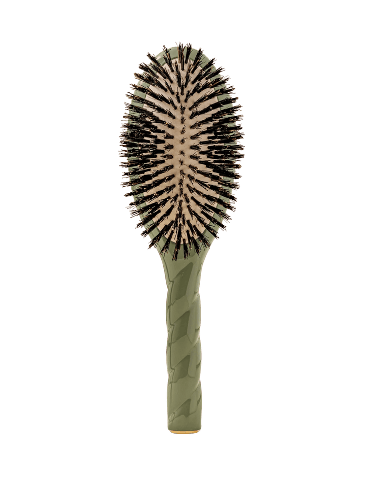 Front view of La Bonne Brosse N.01 The Shine & Care Hairbrush The Universal Brush in Almond Green featuring a twisted ergonomic handle and natural boar bristles | Twentyseven Toronto