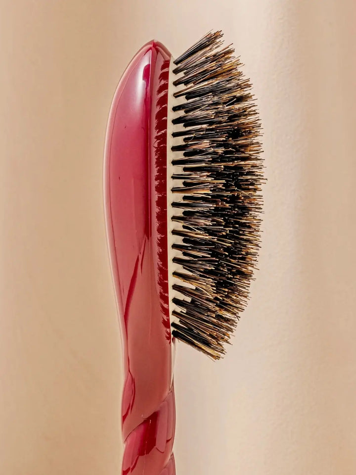 Close-up profile shot highlights the tiered bristle design of La Bonne Brosse N.01 The Shine & Care Hairbrush The Universal Brush in Cherry Red | Twentyseven Toronto