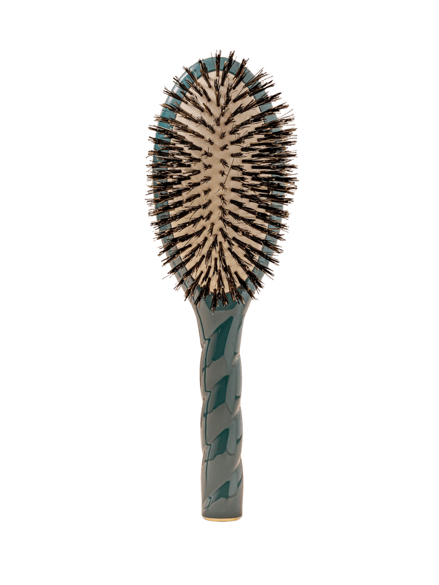 Front view of La Bonne Brosse N.01 The Shine & Care Hairbrush The Universal Brush in Ink Blue featuring a twisted ergonomic handle and natural boar bristles | Twentyseven Toronto