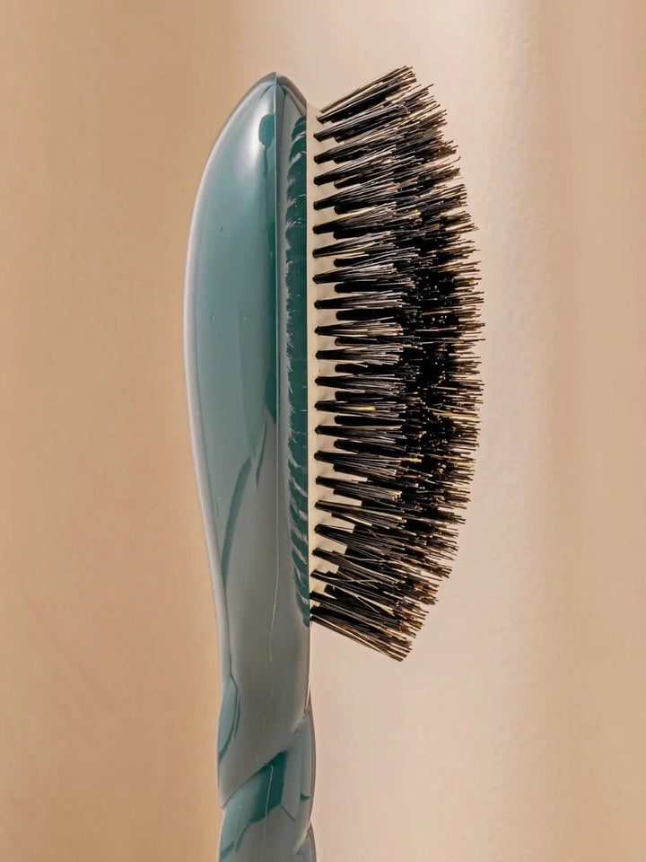 Close-up side profile shot highlights the tiered bristle design of La Bonne Brosse N.01 The Shine & Care Hairbrush The Universal Brush in Ink Blue | Twentyseven Toronto