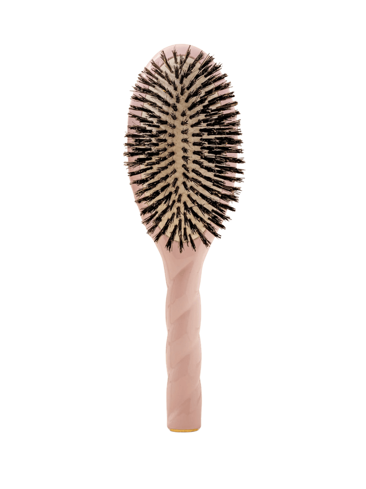 Front view of La Bonne Brosse N.01 The Shine & Care Hairbrush The Universal Brush in Lilac Pink featuring a twisted ergonomic handle and natural boar bristles | Twentyseven Toronto