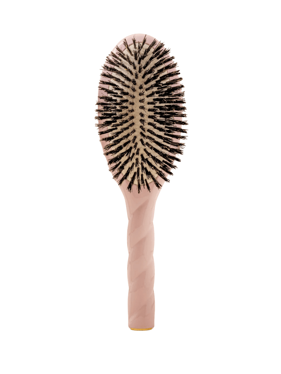 Front view of La Bonne Brosse N.01 The Shine & Care Hairbrush The Universal Brush in Lilac Pink featuring a twisted ergonomic handle and natural boar bristles | Twentyseven Toronto