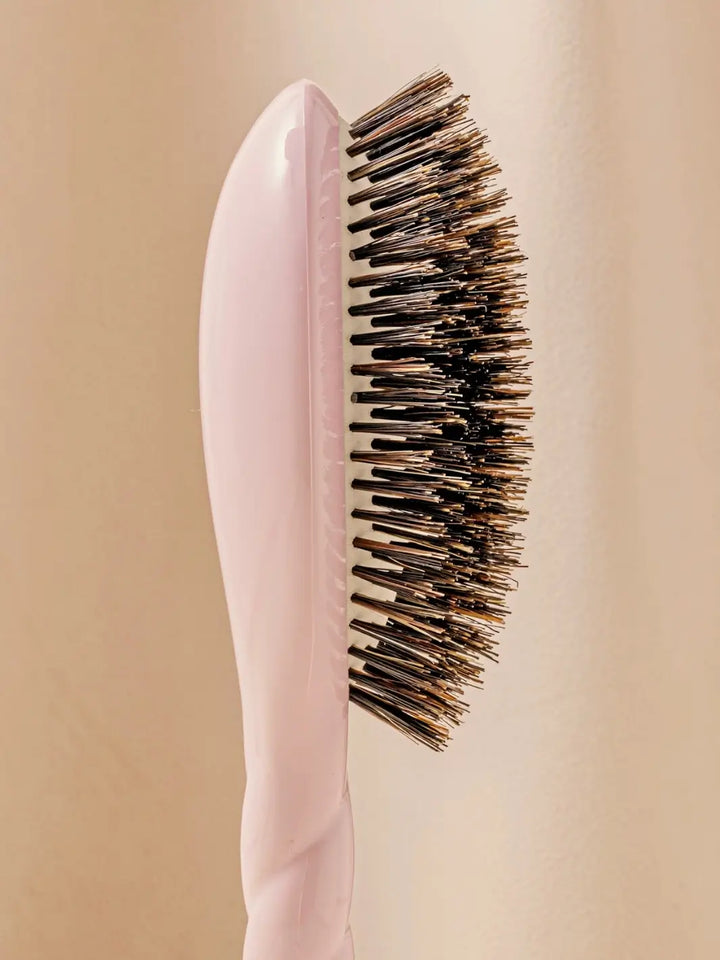 Close-up side profile shot highlights the tiered bristle design of La Bonne Brosse N.01 The Shine & Care Hairbrush The Universal Brush in Lilac Pink | Twentyseven Toronto