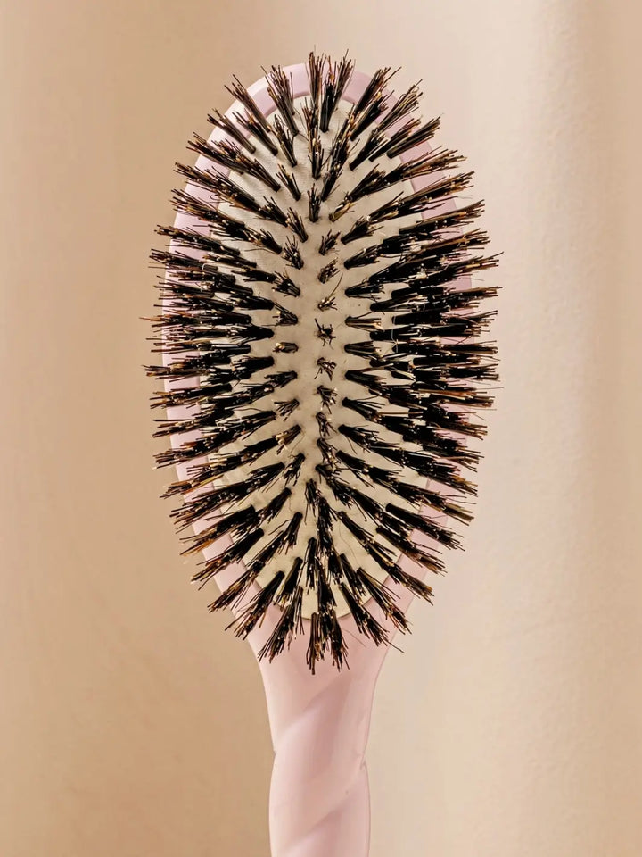 Front shot of the oval head and high-quality tufts of La Bonne Brosse N.01 The Shine & Care Hairbrush The Universal Brush in Lilac Pink | Twentyseven Toronto