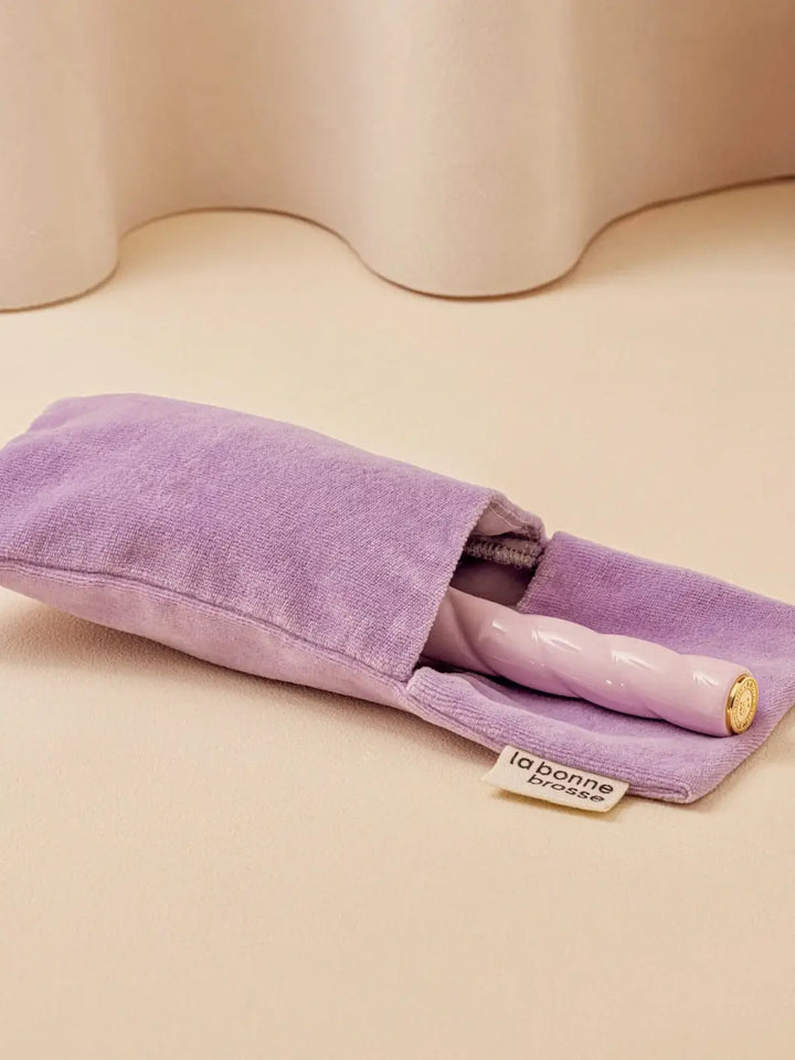 La Bonne Brosse N.01 The Shine & Care Hairbrush The Universal Brush in Orange Coral is partially tucked into a luxurious matching purple velvet travel pouch | Twentyseven Toronto