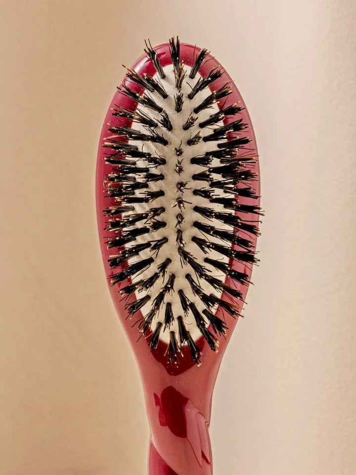 Front close up shot of the oval head and high-quality tufts of La Bonne Brosse N.01 Small The Shine & Care Hairbrush The Universal Brush in Cherry Red | Twentyseven Toronto