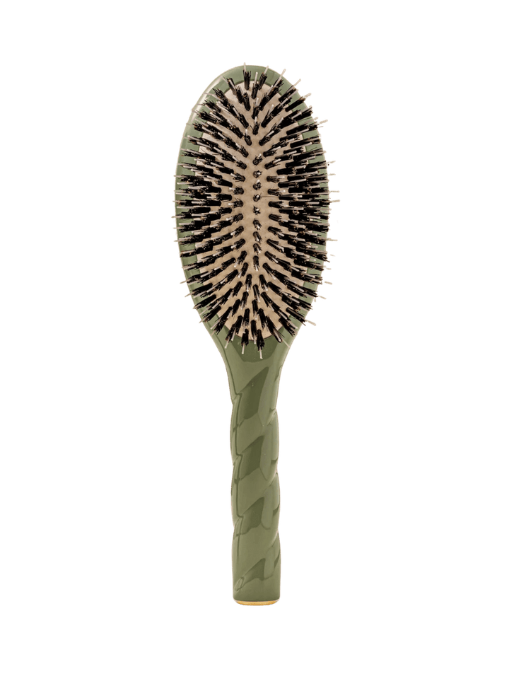 Front view of La Bonne Brosse N.02 Large The Essential Detangling & Conditioning Brush in Almond Green featuring a twisted ergonomic handle and natural boar bristles | Twentyseven Toronto