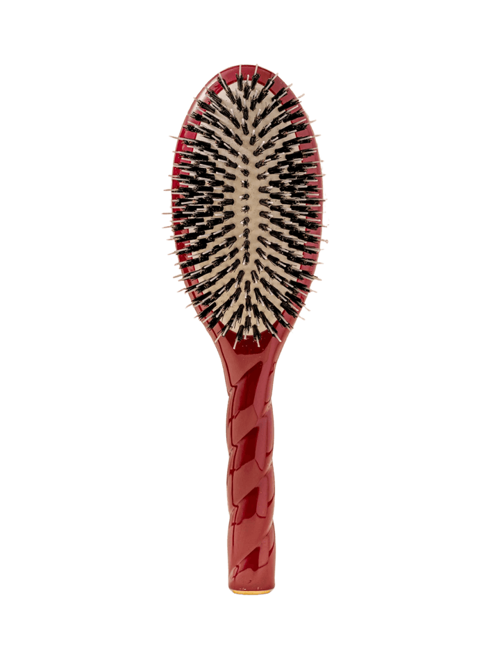 Front view of La Bonne Brosse N.02 Large The Essential Detangling & Conditioning Brush in Cherry Red featuring a twisted ergonomic handle and natural boar bristles | Twentyseven Toronto