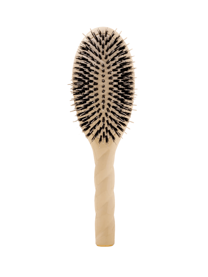 Front view of La Bonne Brosse N.02 Large The Essential Detangling & Conditioning Brush in Creamy White featuring a twisted ergonomic handle and natural boar bristles | Twentyseven Toronto