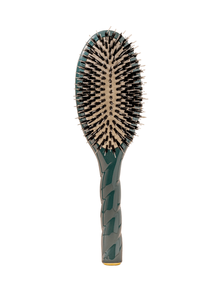 Front view of La Bonne Brosse N.02 Large The Essential Detangling & Conditioning Brush in Ink Blue featuring a twisted ergonomic handle and natural boar bristles | Twentyseven Toronto