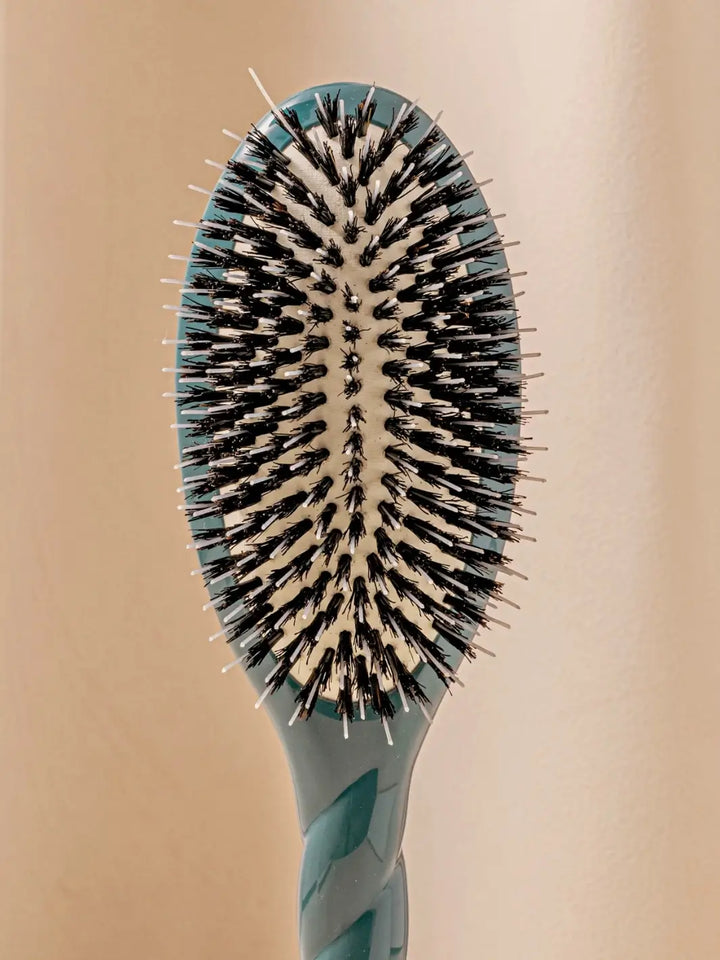 Front shot of the oval head and high-quality tufts of La Bonne Brosse N.02 Large The Essential Detangling & Conditioning Brush in Ink Blue | Twentyseven Toronto