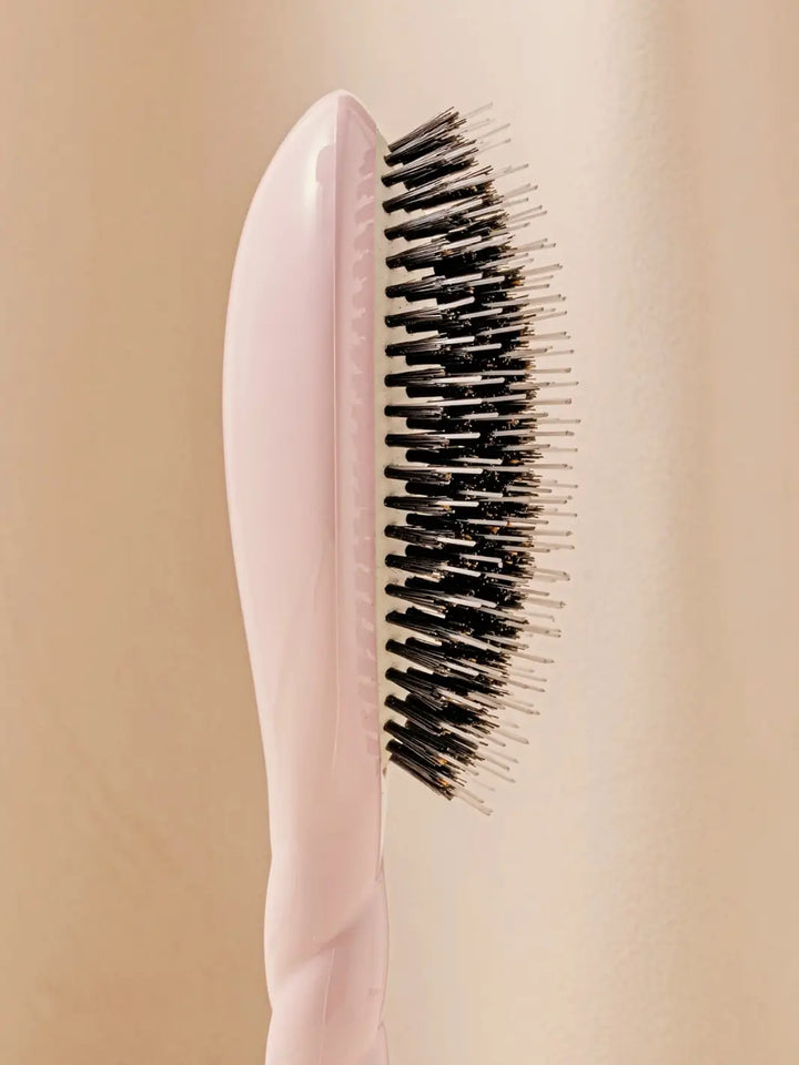Close-up side profile shot highlights the tiered bristle design of La Bonne Brosse N.02 Large The Essential Detangling & Conditioning Brush in Lilac Pink | Twentyseven Toronto