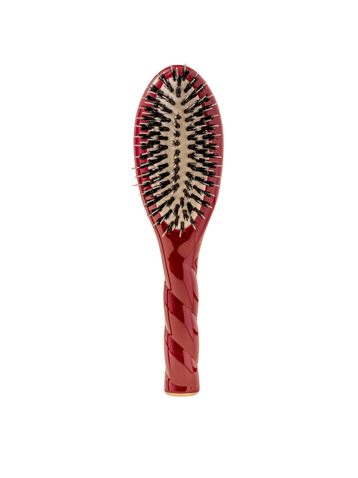 Front view of La Bonne Brosse N.02 Small The Essential Detangling & Conditioning Brush in Cherry Red featuring a twisted ergonomic handle and natural boar and nylon bristles | Twentyseven Toronto