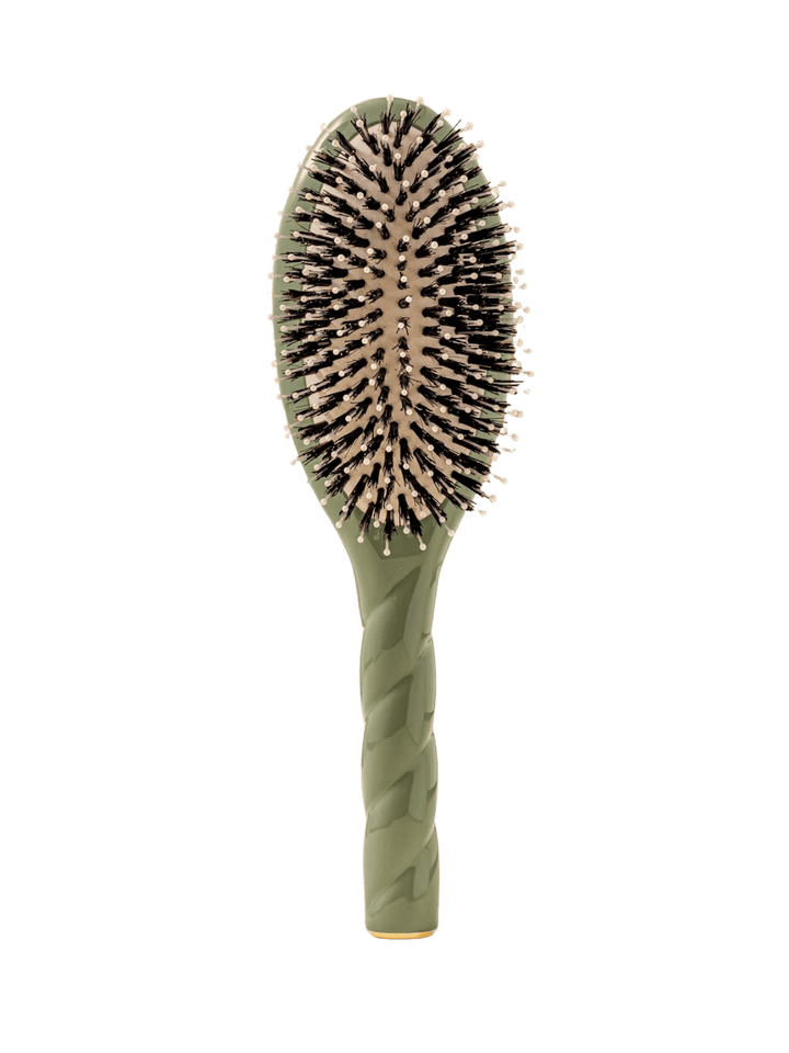 Front view of La Bonne Brosse N.03  Large The Essential Softness & Sensitive Scalp Brush in Almond Green featuring a twisted ergonomic handle, boar bristle and nylon hairbrush | Twentyseven Toronto