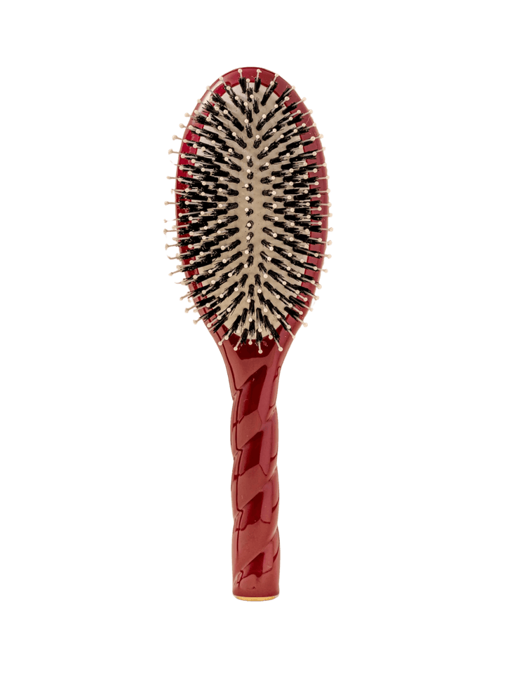 Front view of La Bonne Brosse N.03  Large The Essential Softness & Sensitive Scalp Brush in Cherry Red featuring a twisted ergonomic handle, boar bristle and nylon hairbrush | Twentyseven Toronto