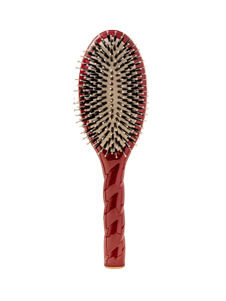 Front view of La Bonne Brosse N.03  Large The Essential Softness & Sensitive Scalp Brush in Cherry Red featuring a twisted ergonomic handle, boar bristle and nylon hairbrush | Twentyseven Toronto