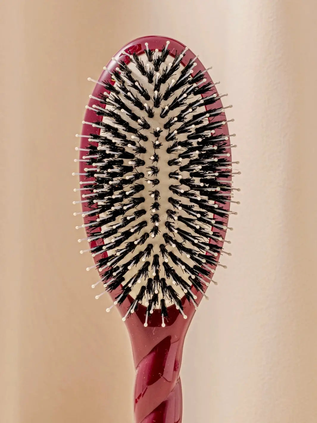Close up front shot of La Bonne Brosse N.03 Large The Essential Softness & Sensitive Scalp Brush in Cherry Red | Twentyseven Toronto