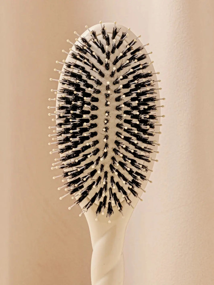 Close up front shot of La Bonne Brosse N.03 Large The Essential Softness & Sensitive Scalp Brush in Creamy White | Twentyseven Toronto