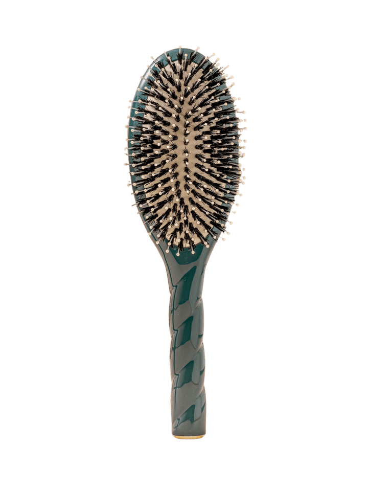 Front view of La Bonne Brosse N.03  Large The Essential Softness & Sensitive Scalp Brush in Ink Blue featuring a twisted ergonomic handle, boar bristle and nylon hairbrush | Twentyseven Toronto