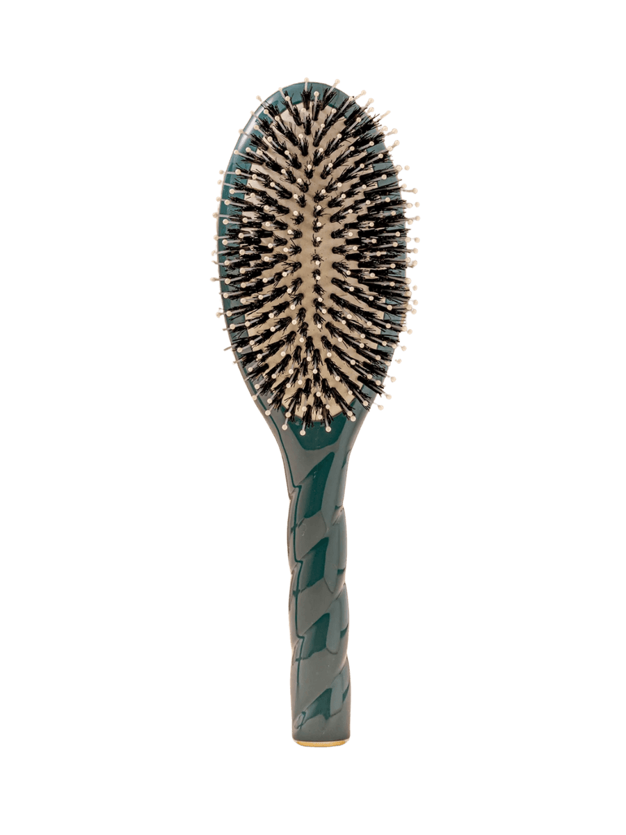 Front view of La Bonne Brosse N.03  Large The Essential Softness & Sensitive Scalp Brush in Ink Blue featuring a twisted ergonomic handle, boar bristle and nylon hairbrush | Twentyseven Toronto