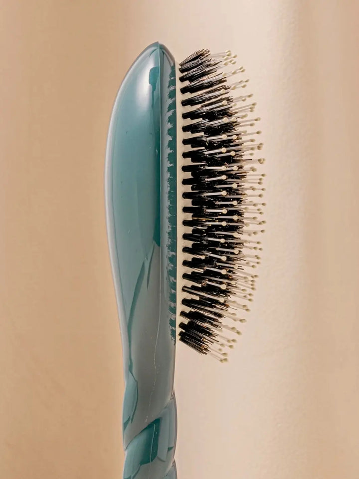 Close-up side image highlights the tiered bristle design of La Bonne Brosse N.03 Large The Essential Softness & Sensitive Scalp Brush in Ink Blue  | Twentyseven Toronto