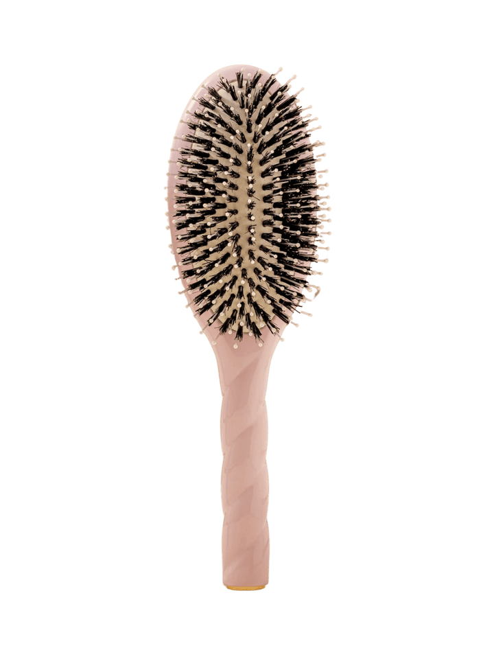 Front view of La Bonne Brosse N.03  Large The Essential Softness & Sensitive Scalp Brush in Lilac Pink featuring a twisted ergonomic handle, boar bristle and nylon hairbrush | Twentyseven Toronto