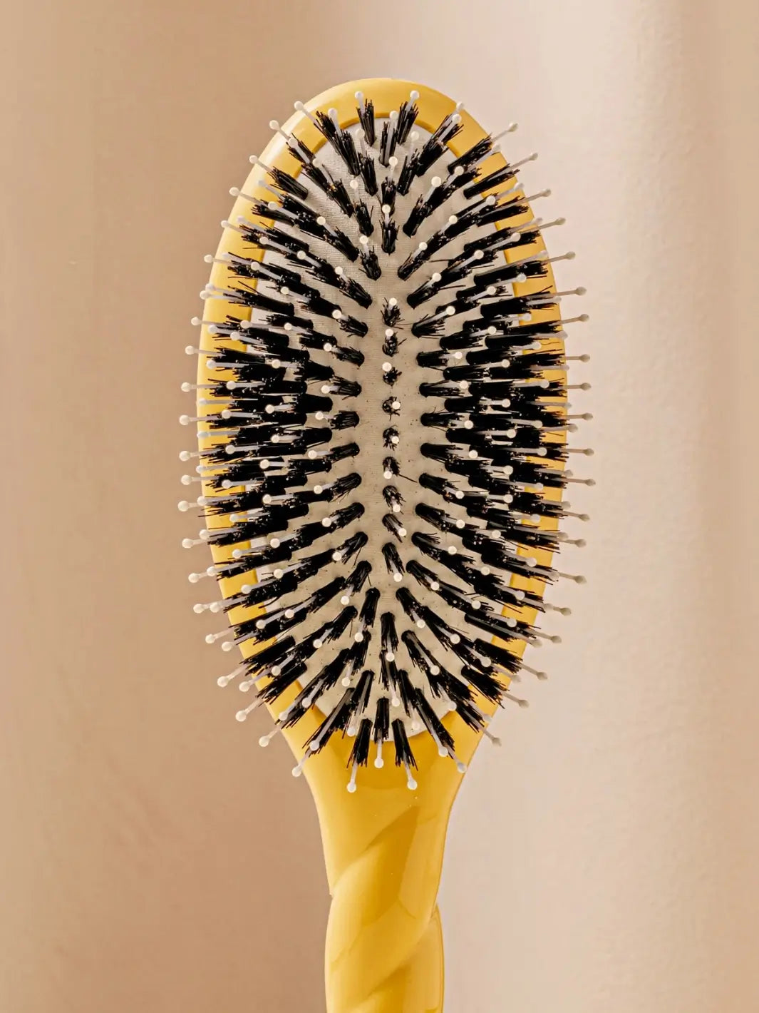 Close up front shot of La Bonne Brosse N.03 Large The Essential Softness & Sensitive Scalp Brush in Saffron Yellow | Twentyseven Toronto