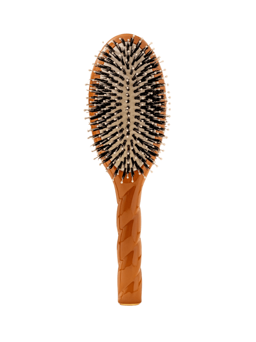 Front view of La Bonne Brosse N.03  Large The Essential Softness & Sensitive Scalp Brush in Terracotta featuring a twisted ergonomic handle, boar bristle and nylon hairbrush | Twentyseven Toronto