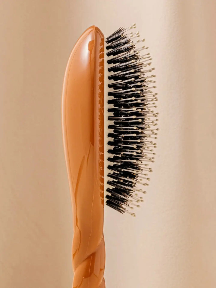 Close-up side image highlights the tiered bristle design of La Bonne Brosse N.03 Large The Essential Softness & Sensitive Scalp Brush in Terracotta | Twentyseven Toronto