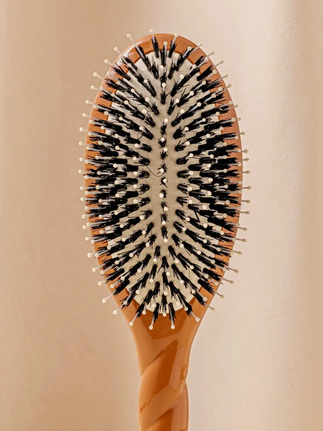 Close up front shot of La Bonne Brosse N.03 Large The Essential Softness & Sensitive Scalp Brush in Terracotta | Twentyseven Toronto
