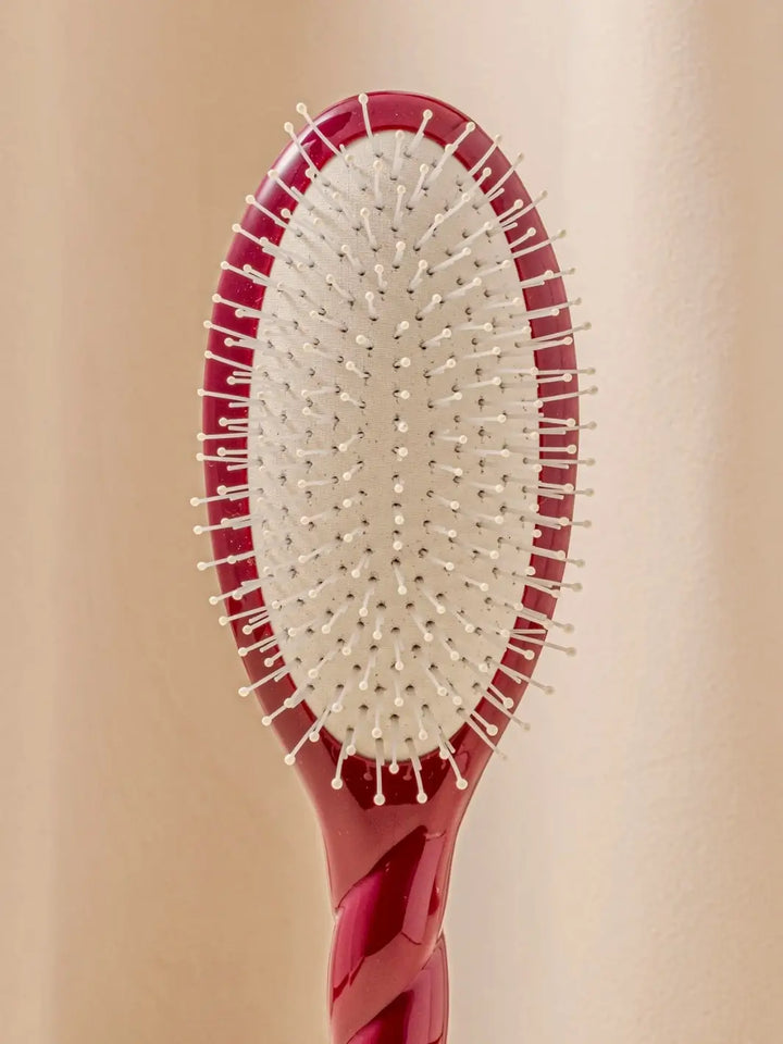 Close up front shot of La Bonne Brosse N.04 Large The Detangling & Massaging Miracle Brush in Cherry Red featuring nylon bristles | Twentyseven Toronto