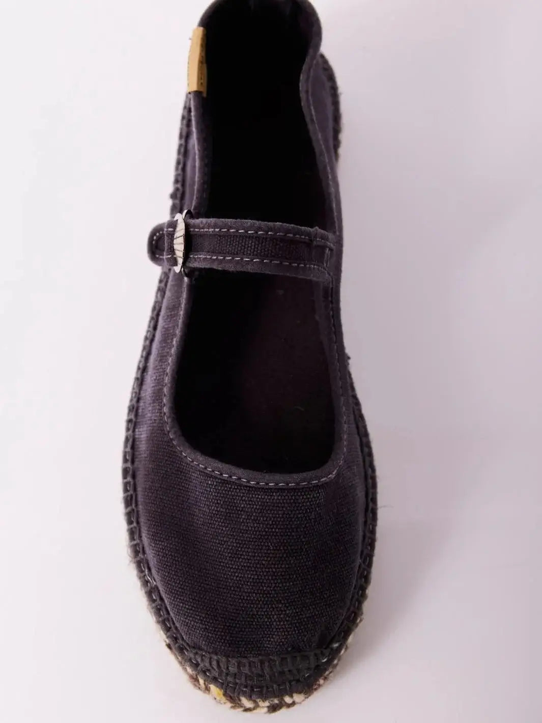A top-down product shot details the canvas upper, open throat line, and inner sole lining of a single Free People Oasis Mary Jane Espadrilles - Washed Black | Twentyseven Toronto
