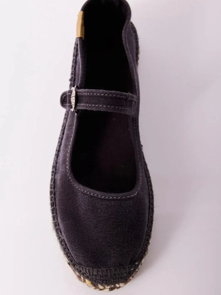 A top-down product shot details the canvas upper, open throat line, and inner sole lining of a single Free People Oasis Mary Jane Espadrilles - Washed Black | Twentyseven Toronto