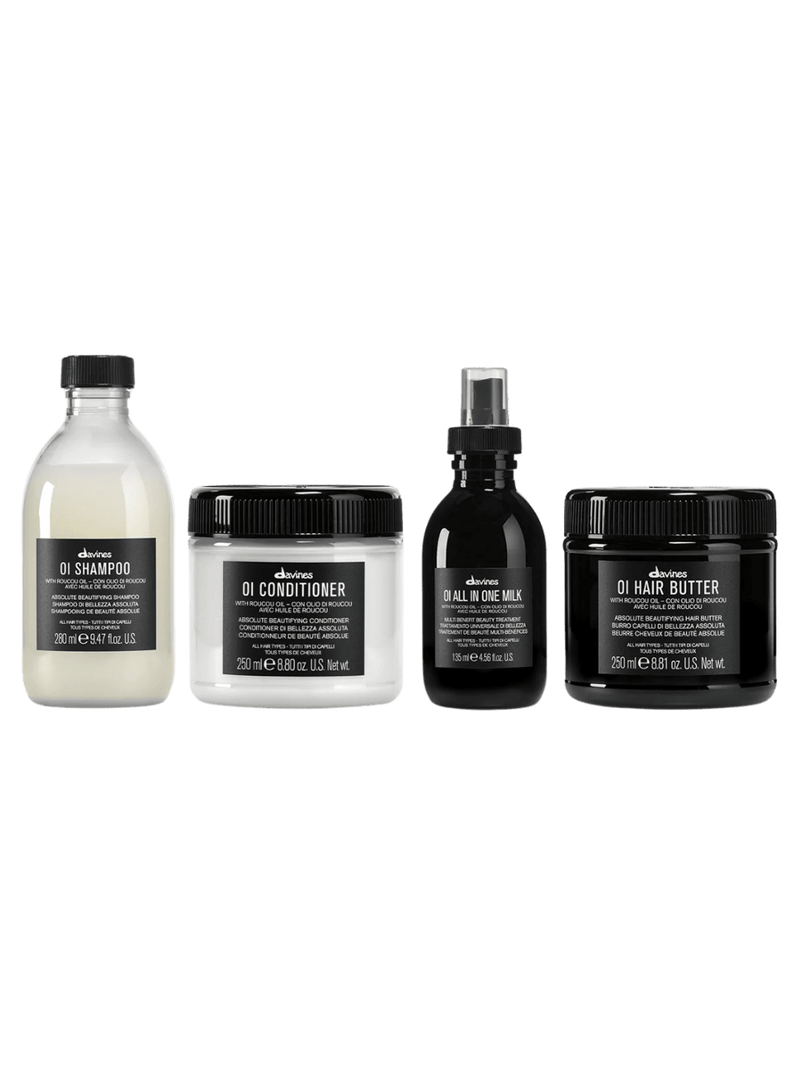 Set of four Davines hair care products including OI Shampoo (250ml), OI Conditioner (250ml), OI All in One Milk (135ml) and OI Hair Butter (250ml) a on a transparent background | Twentyseven Toronto