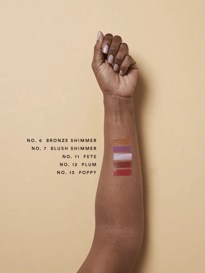 Olio E Osso balm swatches on an arm with darker complexion | Twentyseven Toronto