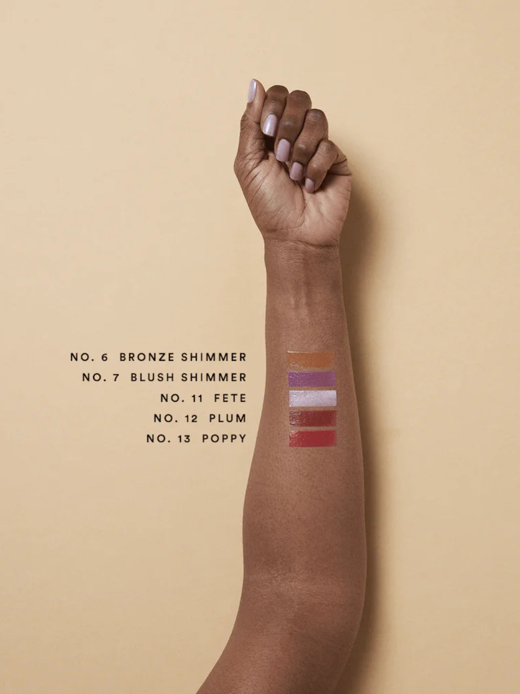 Olio E Osso balm swatches on an arm with darker complexion | Twentyseven Toronto