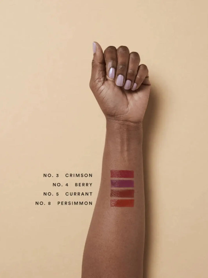 Olio E Osso balm swatches on an arm with darker complexion | Twentyseven Toronto