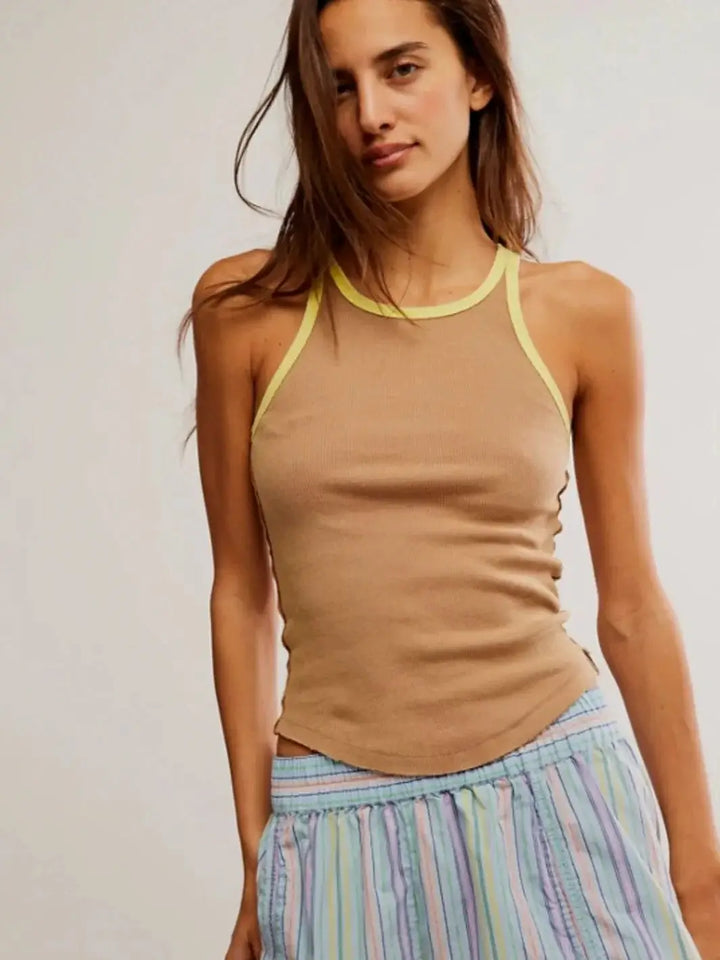 A front view shows a model standing in the slim-fitting Free People Only 1 Solid Ringer Tank - Praline Sunshine Combo paired with colorful striped pajama shorts | Twentyseven Toronto